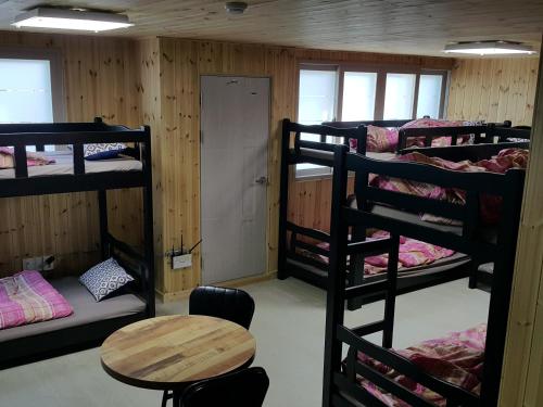 Postel nebo postele na pokoji v ubytování Guest House Manna