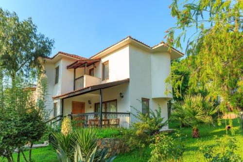 an image of a house with a garden at Orka World Hotel & Aquapark in Oludeniz
