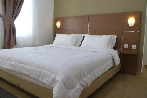 Posteľ alebo postele v izbe v ubytovaní Diyar Villas Puncak R7-3