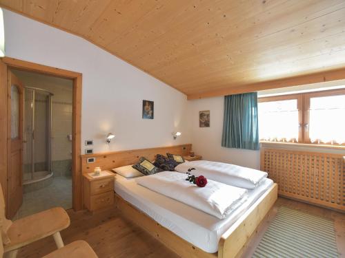 Postel nebo postele na pokoji v ubytování Residence Salvan