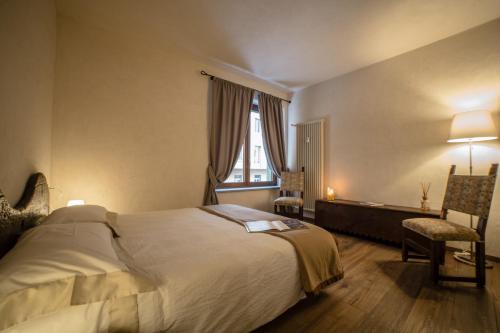Postel nebo postele na pokoji v ubytování Maison Aosta