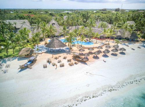 an aerial view of a beach with chairs and umbrellas at Kiwengwa Beach Resort in Kiwengwa