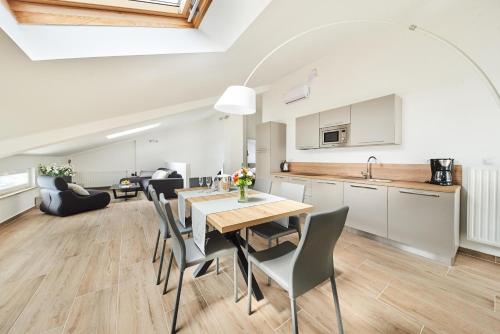 a kitchen and dining room with a table and chairs at Ribarska Koliba Resort in Pula