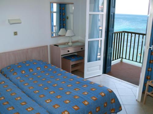 Katil atau katil-katil dalam bilik di Lemos Hotel