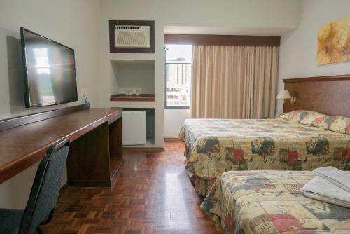 Real Palace Hotel tesisinde bir odada yatak veya yataklar