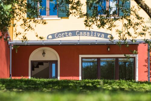 a building with a sign for a coffee restaurant at Casaliva Relais in Bardolino