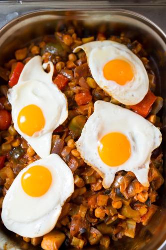 a bowl of food with eggs on top of beans at Hotel & Restauracja Gniecki in Hrubieszów