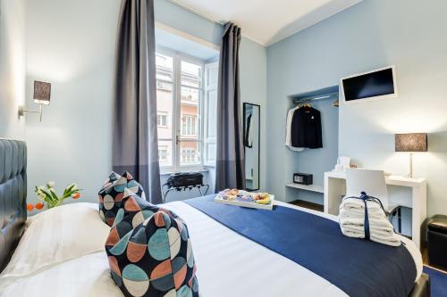 a hotel room with a bed and a window at Easy Budget Colosseo in Rome