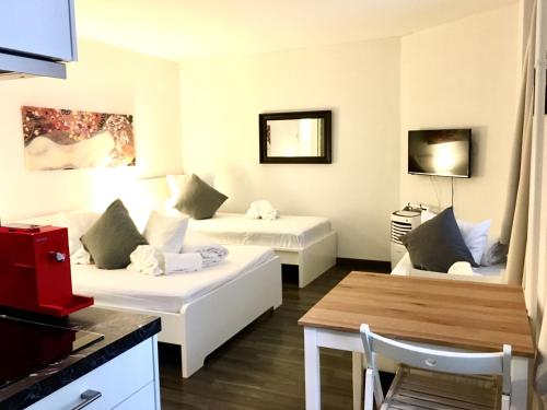 Ένα ή περισσότερα κρεβάτια σε δωμάτιο στο INSIDE FIVE - City Apartments