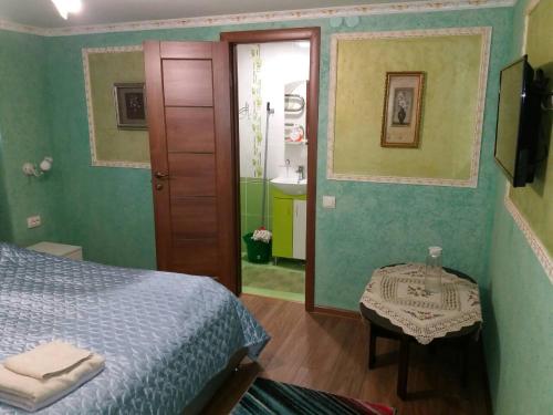 Katil atau katil-katil dalam bilik di Guest House Zhanna