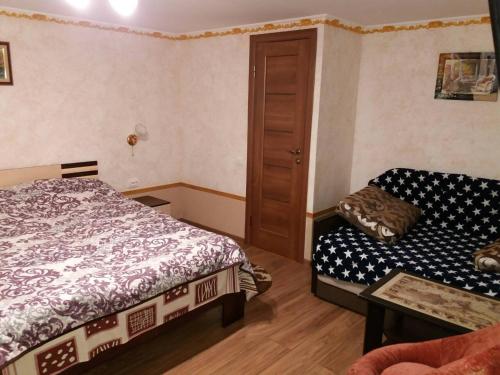 Postel nebo postele na pokoji v ubytování Guest House Zhanna