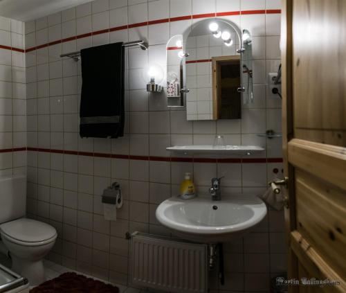 Ванная комната в Alte Poststation Goldener Hirsch