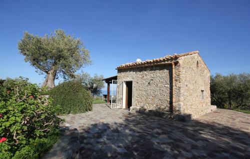 an external view of a stone building with a door at Casa Margaret in Collesano