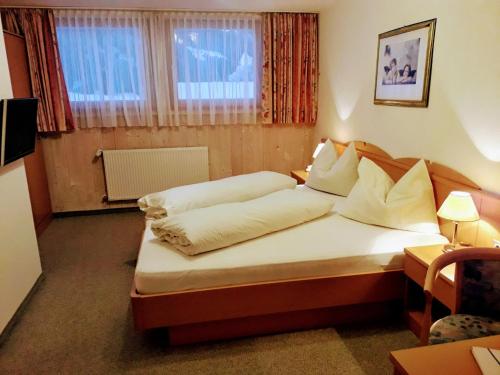 Un pat sau paturi într-o cameră la Reschnerhof
