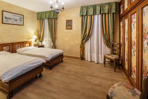 Кровать или кровати в номере Hotel Olimpia