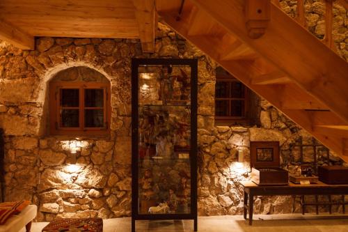 a stone room with a staircase and a stone wall at Living History (adults only) in Hallstatt