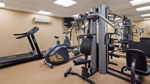 a gym with treadmills and elliptical machines at Best Western DuBois Hotel in DuBois