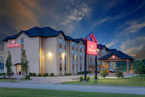 a rendering of a hotel at night at Ramada by Wyndham Cold Lake in Cold Lake