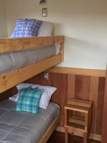 Ein Bett oder Betten in einem Zimmer der Unterkunft Almabosque Cabañas