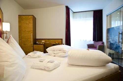 Krevet ili kreveti u jedinici u objektu Hotel Garni Arosa