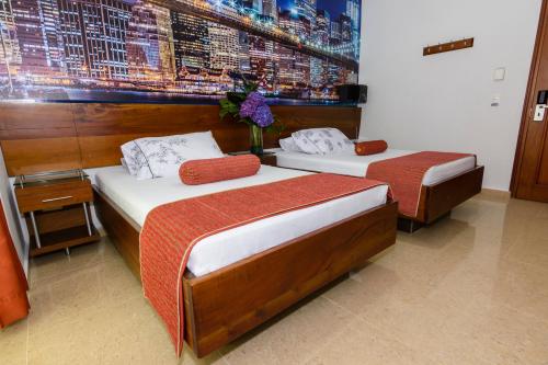 En eller flere senge i et værelse på Hotel Sauces del Estadio