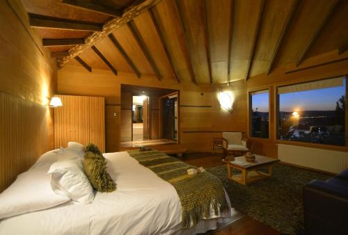Postel nebo postele na pokoji v ubytování OCIO Territorial Hotel