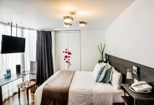 Postel nebo postele na pokoji v ubytování Dreams Hotel Boutique
