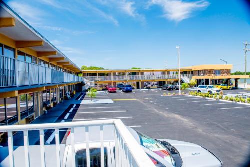 a parking lot in front of a large building at Lakeview Motel in Lakeland