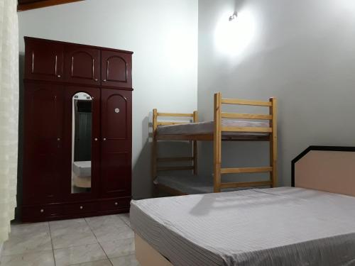 En eller flere senge i et værelse på Casa com Quintal Amplo