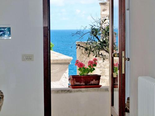 a view of the ocean from a room with a window at B&B Casa Dorsi in Polignano a Mare