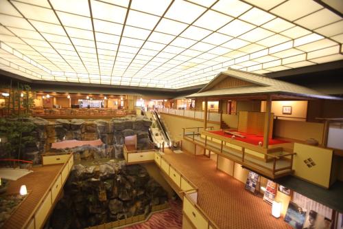 a large building with a large rock wall at Kashikojima Hojoen in Shima