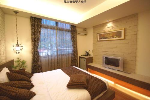 Cama o camas de una habitación en 谷關明高溫泉 Mingao Hot Spring Resort