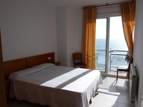 Postel nebo postele na pokoji v ubytování Apartaments Tropic