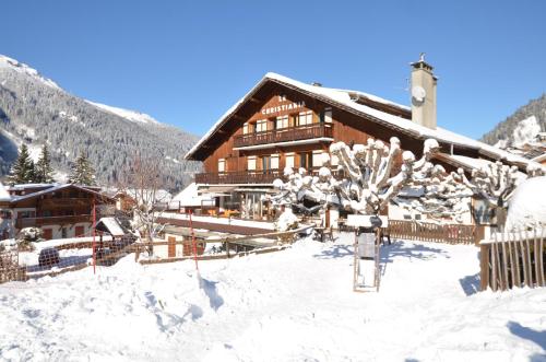 a ski lodge with snow on the ground at Hotel Le Christiania in Les Contamines-Montjoie