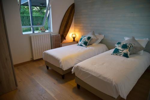 Tempat tidur dalam kamar di Villa Parenthese