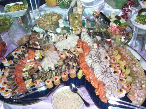 a table with a bunch of different types of food at Landgasthof zum Brückenwirt in Starnberg