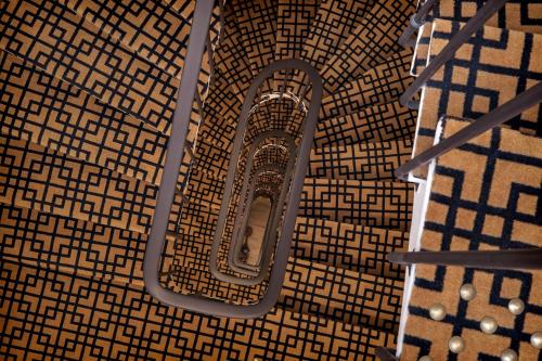 an overhead view of a mirror on a wall at Doisy Etoile - Orso Hotels in Paris