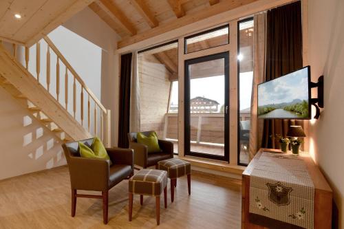 TV o dispositivi per l'intrattenimento presso Narzenhof Wellness Chalets, Familien & Luxus Apartments am Bauernhof