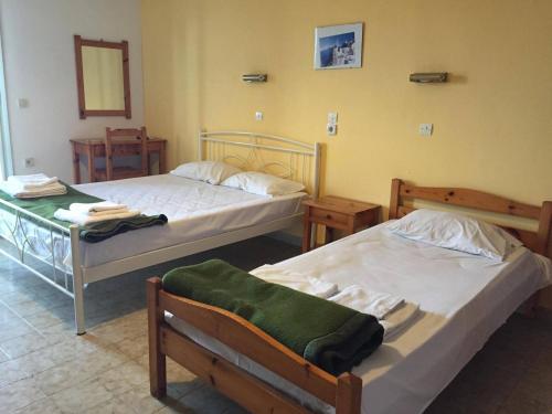 A bed or beds in a room at Avgoustina Venus Studios