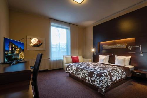 Postel nebo postele na pokoji v ubytování Hotel Villa Bianca
