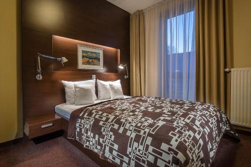 Ένα ή περισσότερα κρεβάτια σε δωμάτιο στο Hotel Villa Bianca