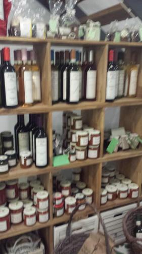a shelf filled with lots of bottles of wine at Holzwerk Oybin in Kurort Oybin