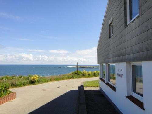 a building with a view of the ocean at Gaestehaus Cap Hoorn in Helgoland