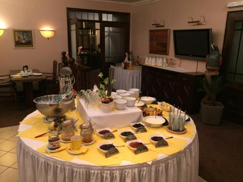 a table with food on it in a room at Hotel-Marks-Garni in Zingst