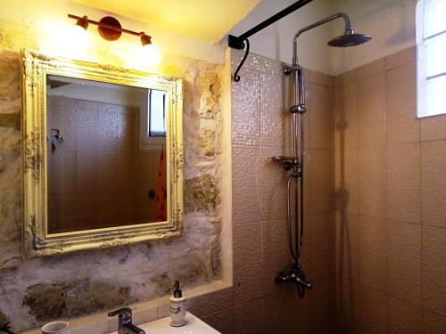 a bathroom with a mirror and a sink at Villa Filiza in Sívas