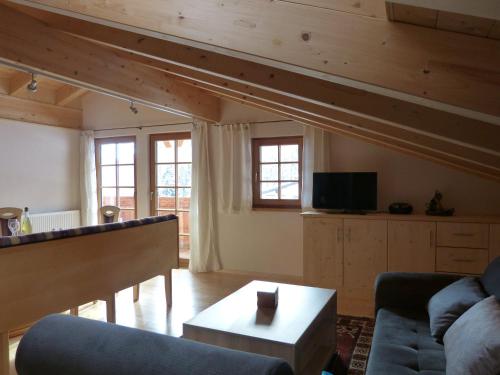 a living room with a couch and a table at Berghütte Schöpf in Umhausen