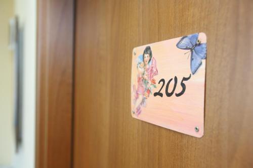 a door with a sign that says on it at Hotel Varosha in Lovech