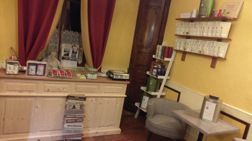 a room with a table and a chair in a store at Logis de L'Europe Restaurant Le Cepage in Corbigny