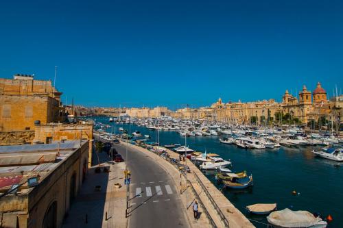 a group of boats parked in a harbor at Cugo Gran Macina Malta in Senglea