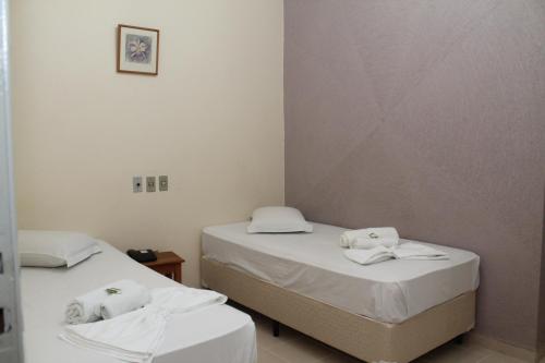 Posteľ alebo postele v izbe v ubytovaní Emburi Hotel
